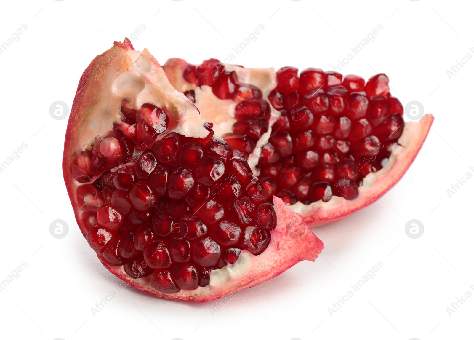 Photo of Pieces of ripe pomegranate on white background