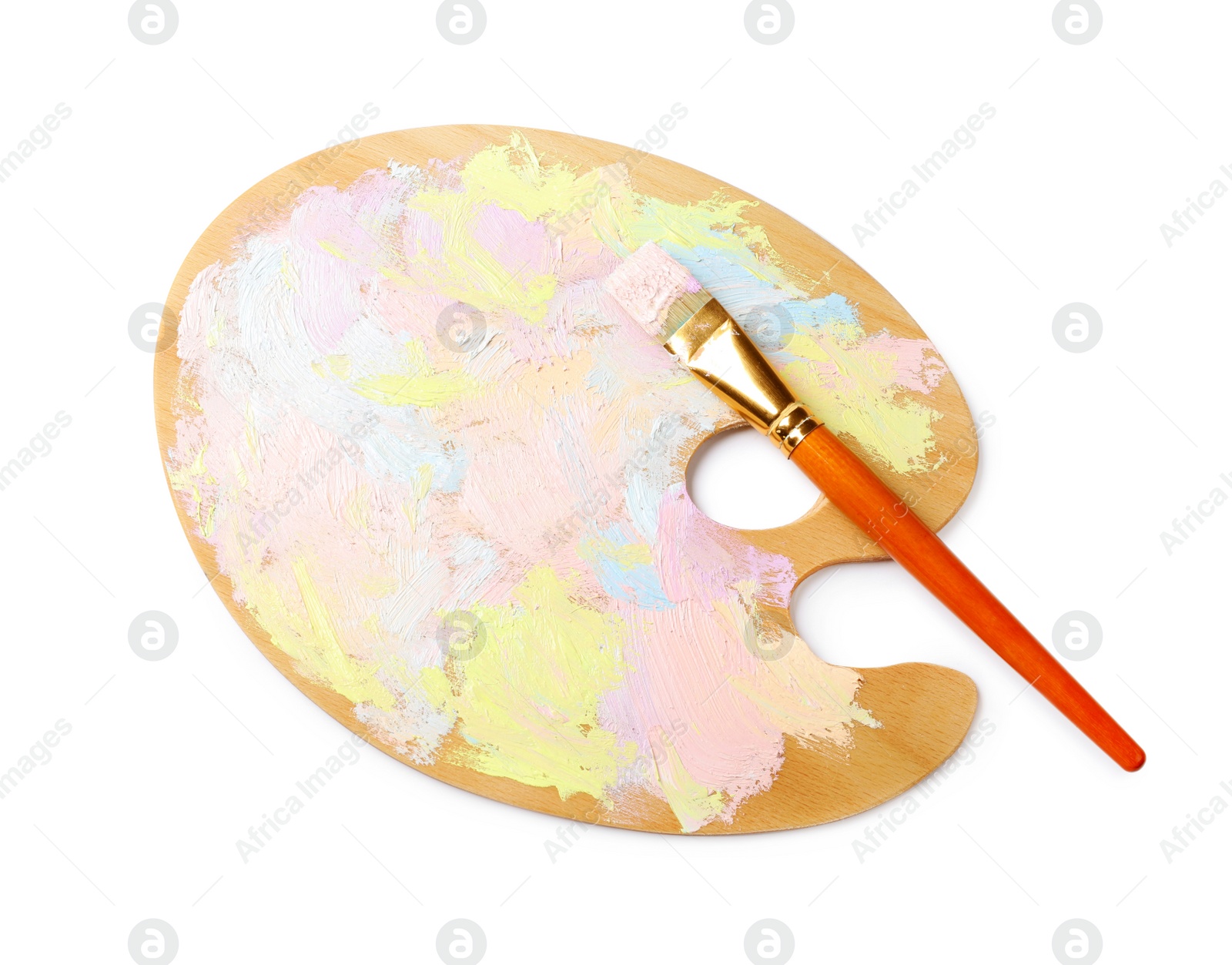Photo of Wooden artist's palette with mixed pastel paints and brush isolated on white, top view