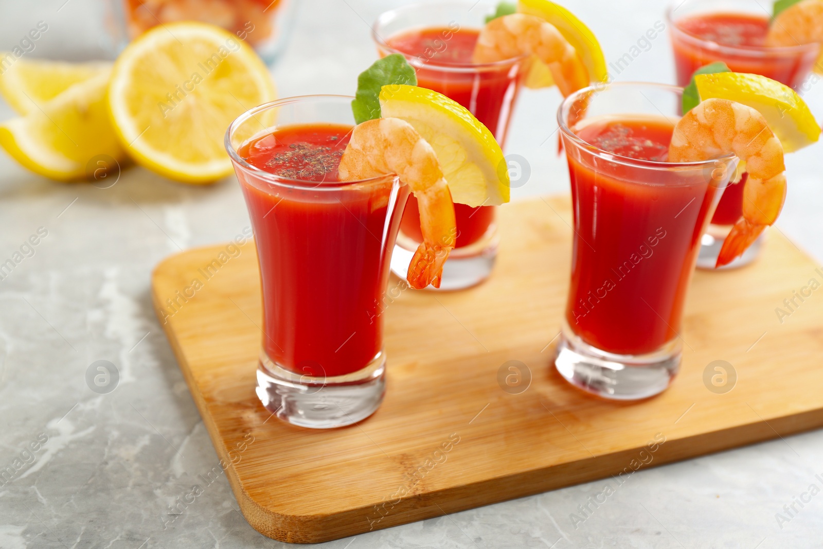 Photo of Delicious shrimp cocktail with tomato sauce served on  table