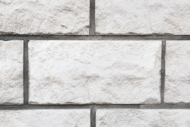 Photo of Texture of white brick wall as background, closeup