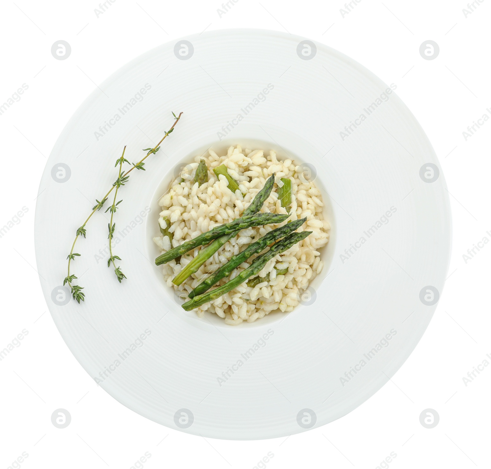Photo of Delicious risotto with asparagus isolated on white, top view