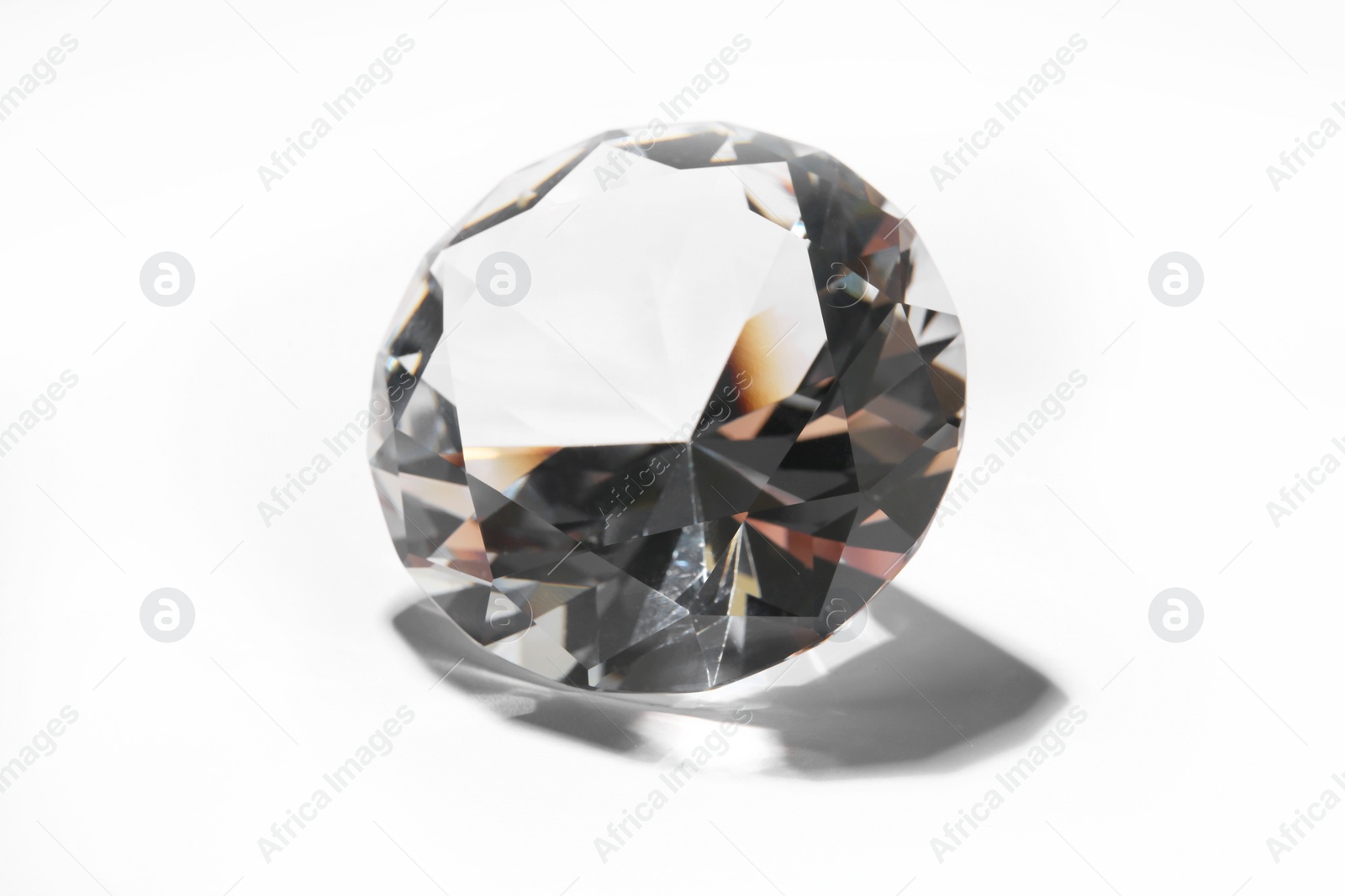 Photo of One beautiful shiny diamond on white background, closeup
