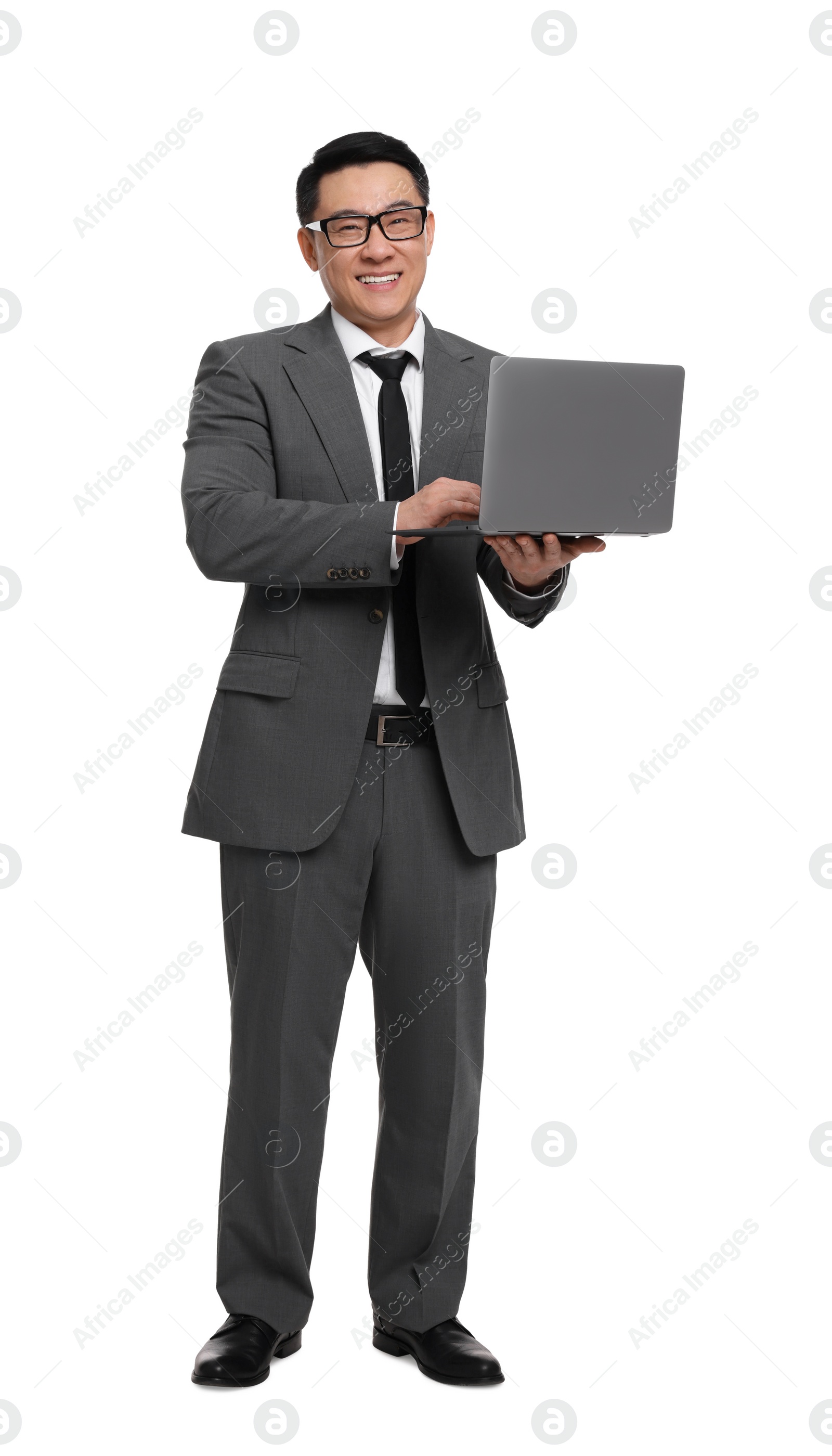 Photo of Businessman in suit working on laptop against white background