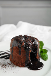 Photo of Delicious warm chocolate lava cake on plate
