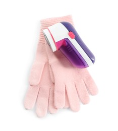 Modern fabric shaver and woolen gloves on white background, top view