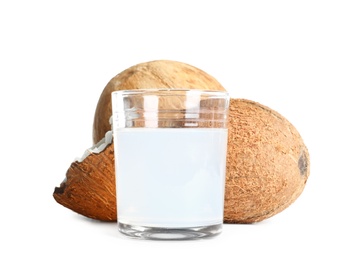 Photo of Glass of coconut milk and nuts on white background