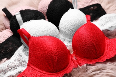 Photo of Beautiful lace bras on faux fur. Stylish underwear