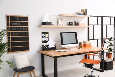 Modern computer on table in office interior. Stylish workplace