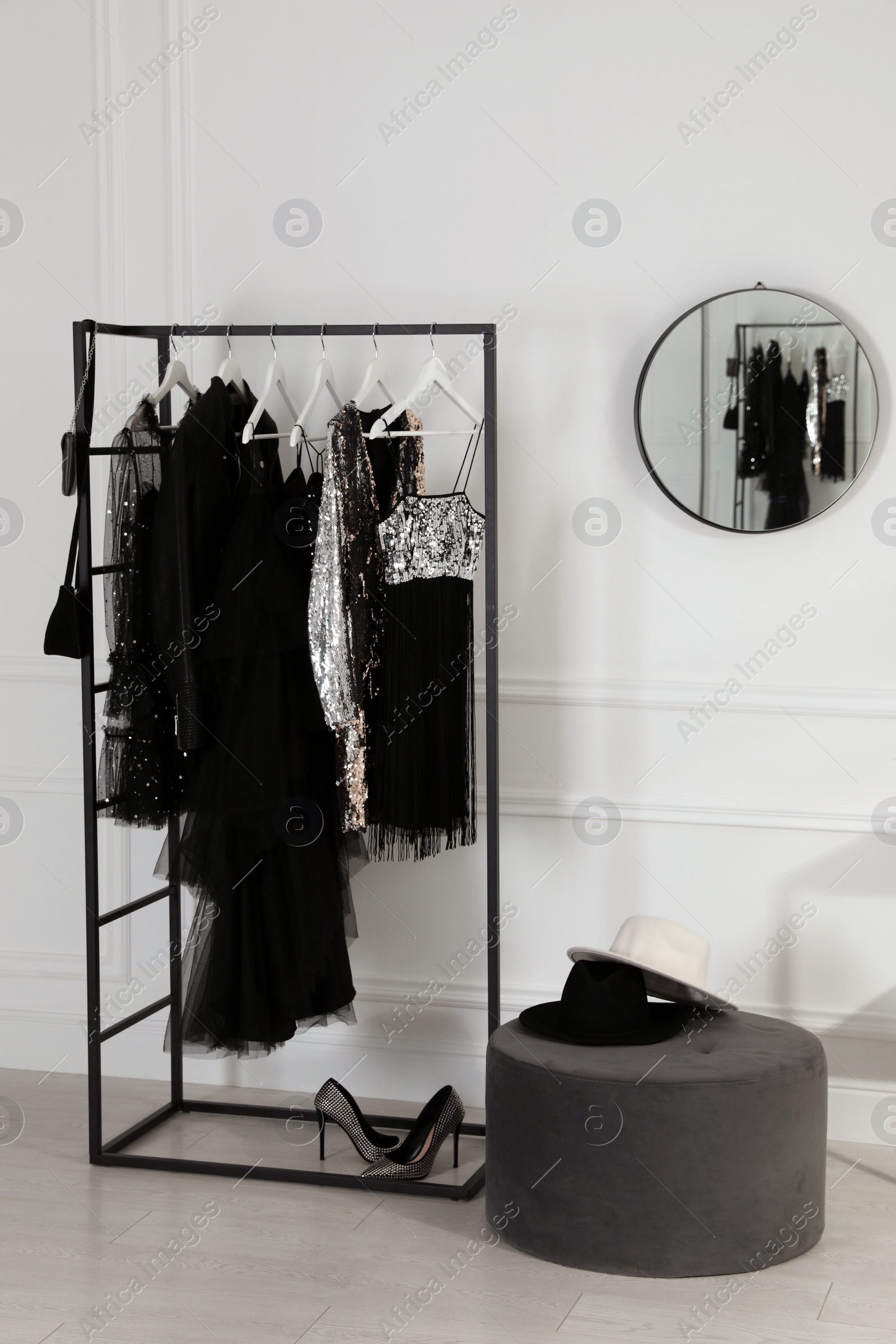 Photo of Stylish dressing room interior with trendy clothes, shoes and accessories