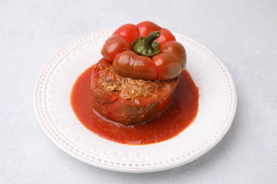 Photo of Delicious stuffed bell pepper on light table