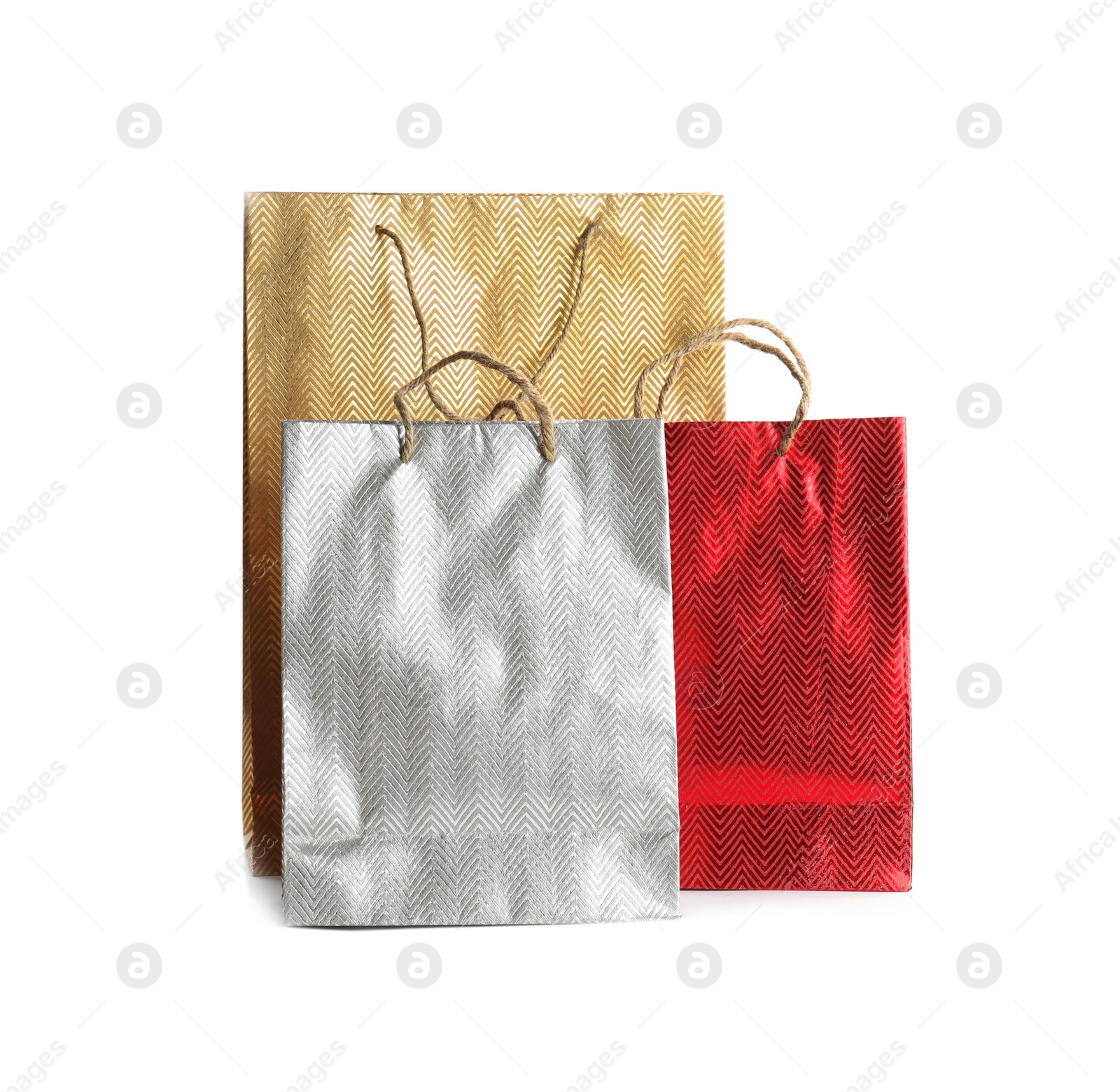 Photo of Color paper shopping bags isolated on white. Space for design