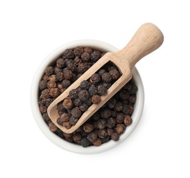 Photo of Aromatic spice. Many black peppercorns in bowl and scoop isolated on white, top view