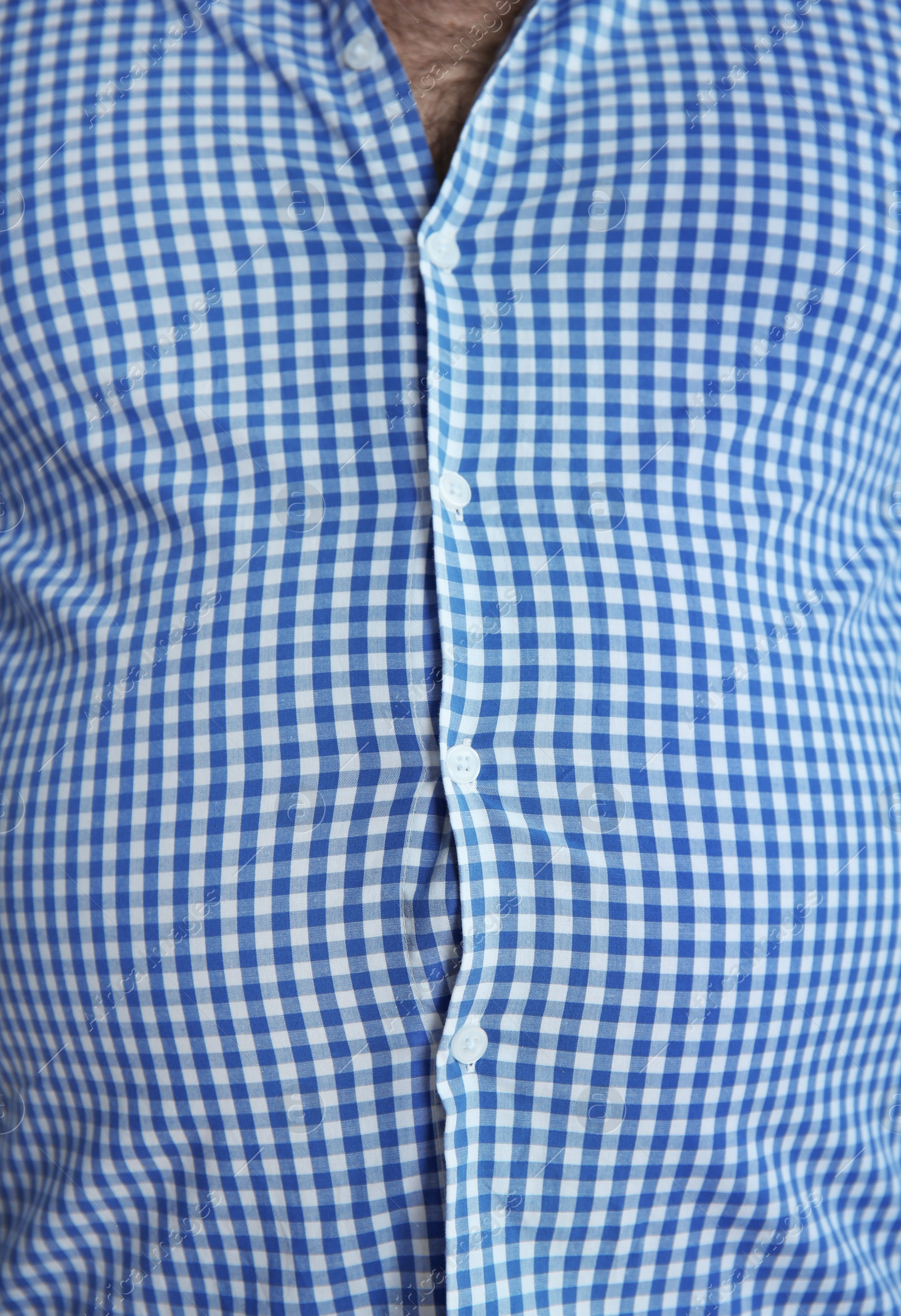 Photo of Overweight person in tight clothes, closeup