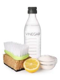 Photo of Eco friendly natural cleaners. Vinegar in bottle, brush, bowl of soda, cut lemon and sponge isolated on white