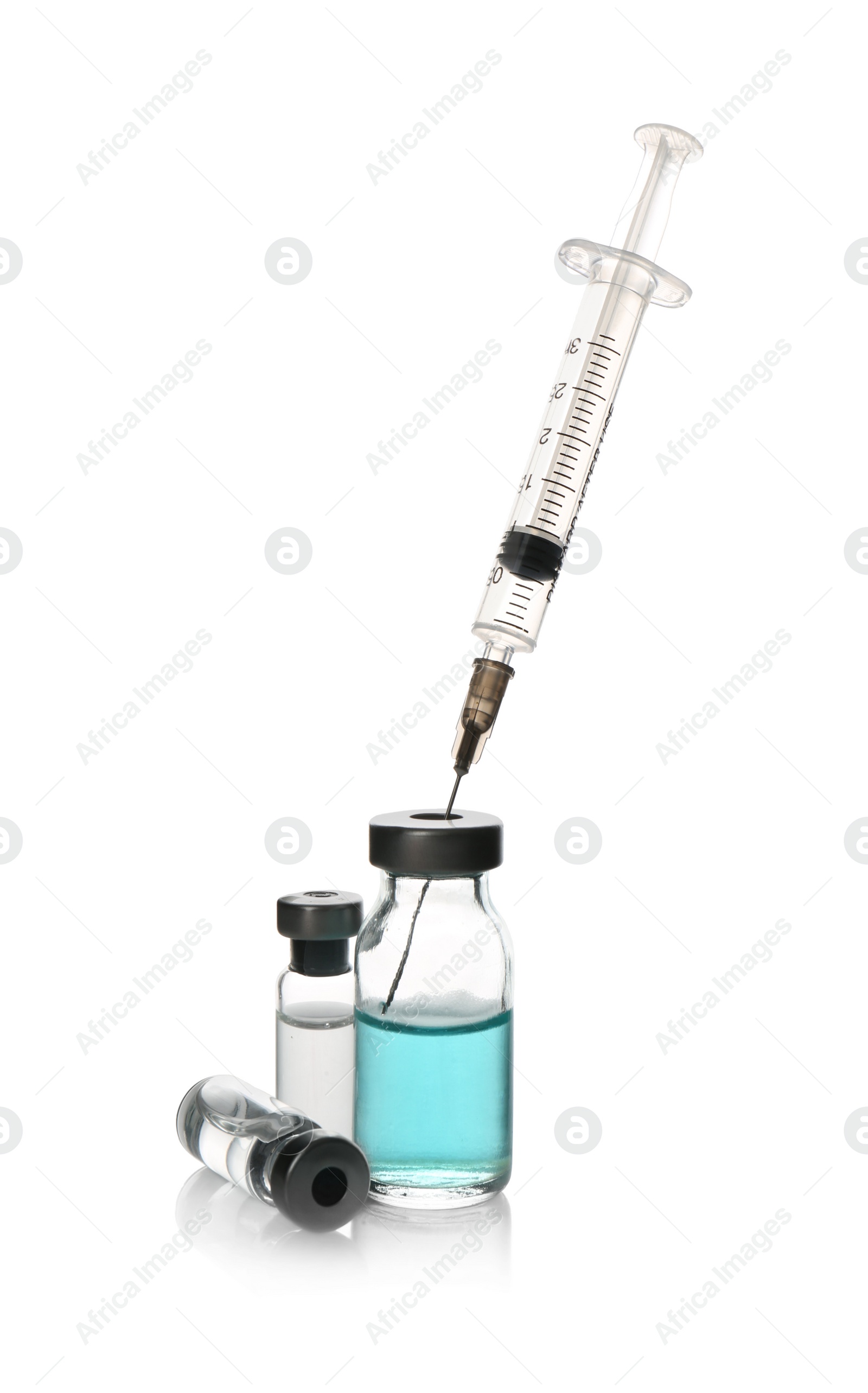 Photo of Syringe with vials of medicine on white background