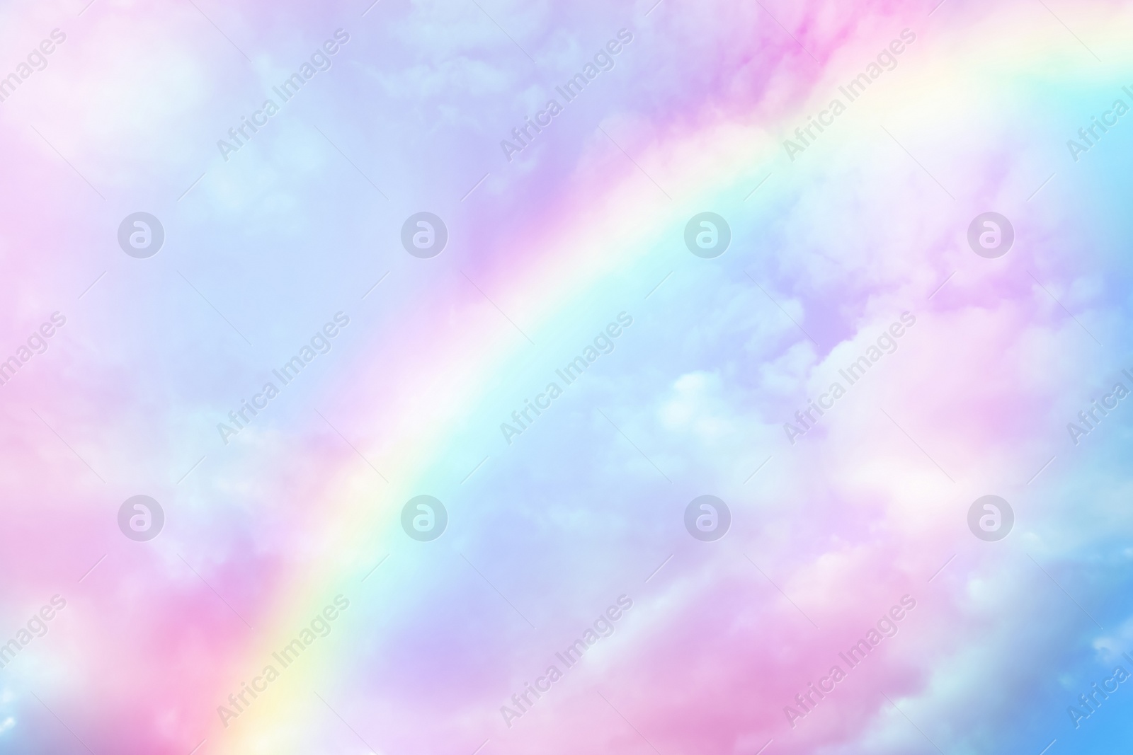 Image of Amazing sky with rainbow and fluffy clouds, toned in unicorn colors