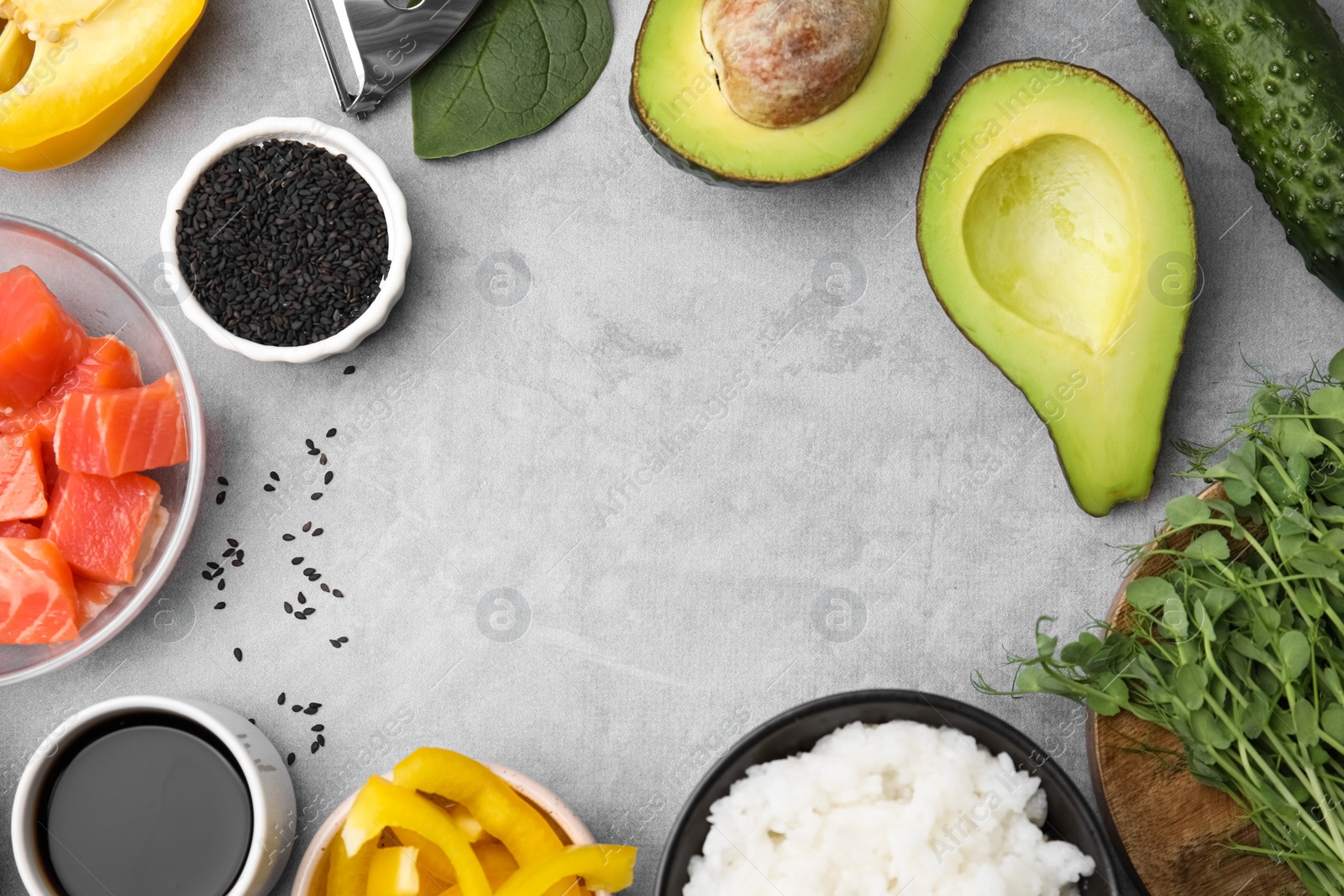 Photo of Ingredients for poke bowl on grey table, flat lay. Space for text