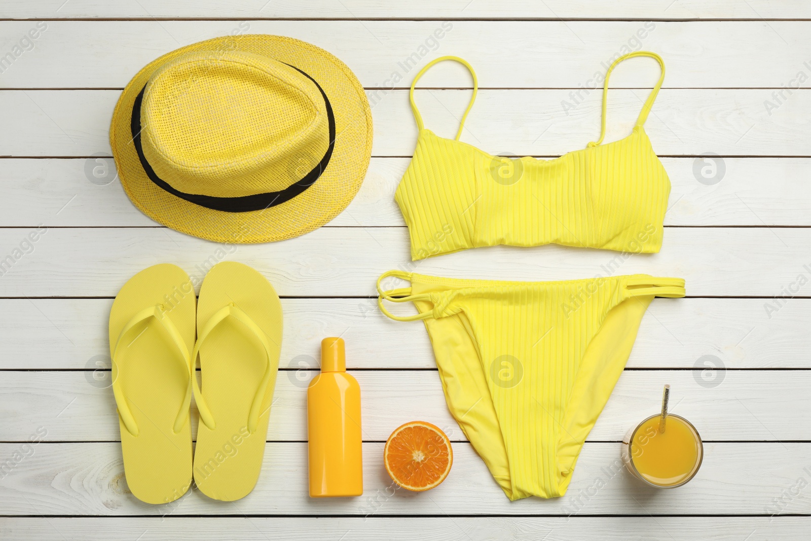 Photo of Flat lay composition with beach objects on white wooden background