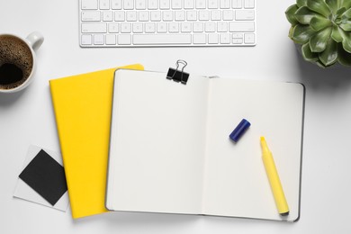 Flat lay composition with stylish notebooks on white table