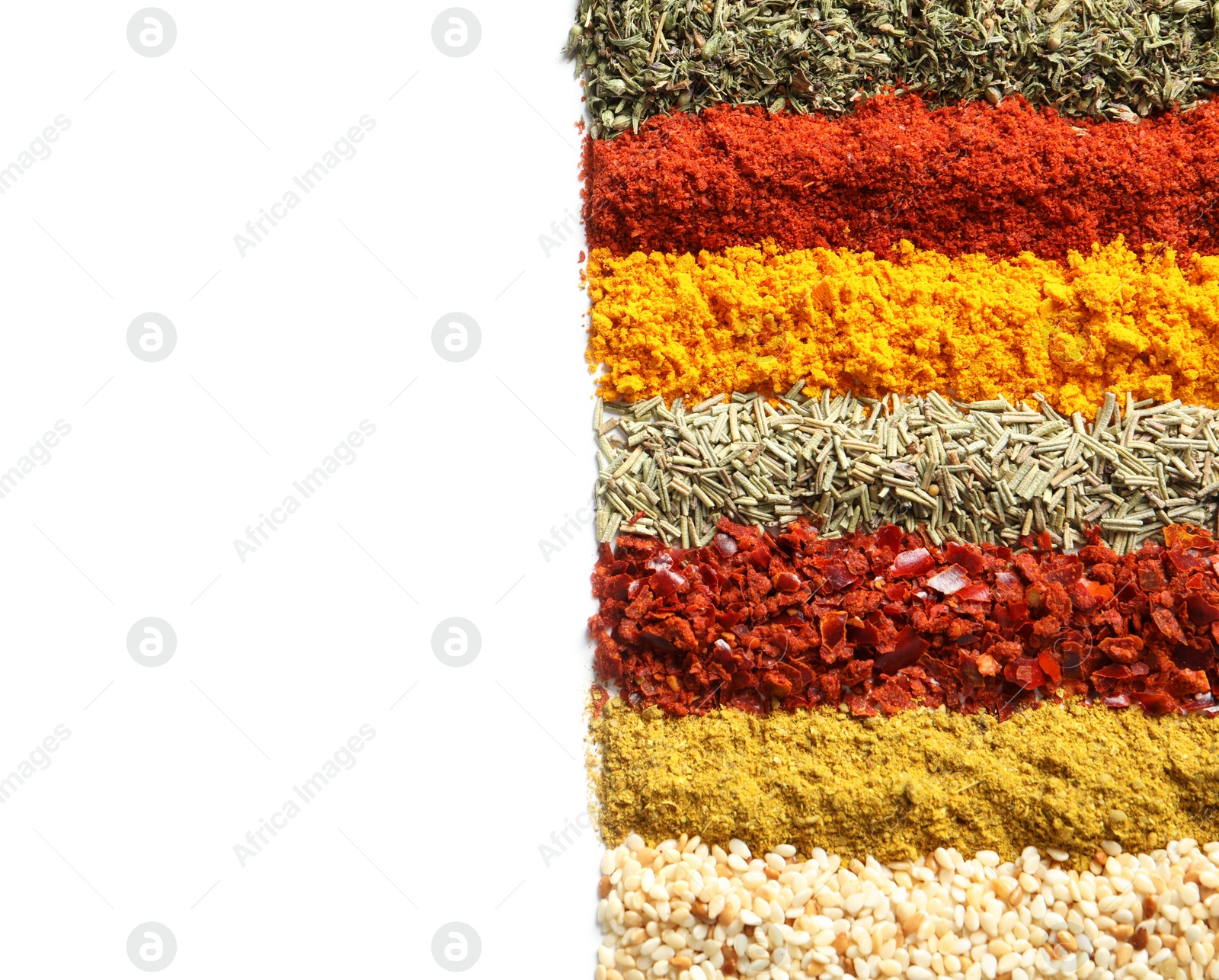 Photo of Rows of different aromatic spices on white background, top view with space for text