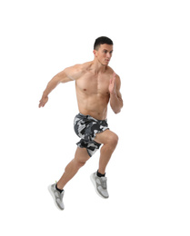 Photo of Athletic young man running on white background