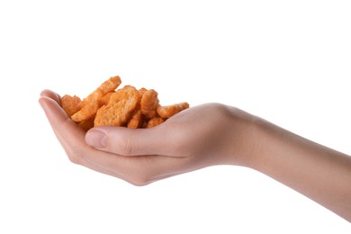 Woman holding crispy rusks on white background, closeup