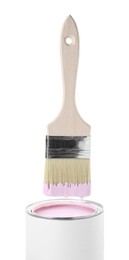 Photo of Brush with pink paint over can isolated on white