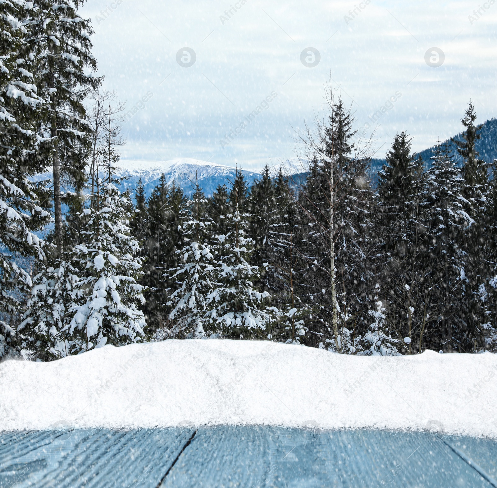 Image of Wooden surface and beautiful view of winter landscape 