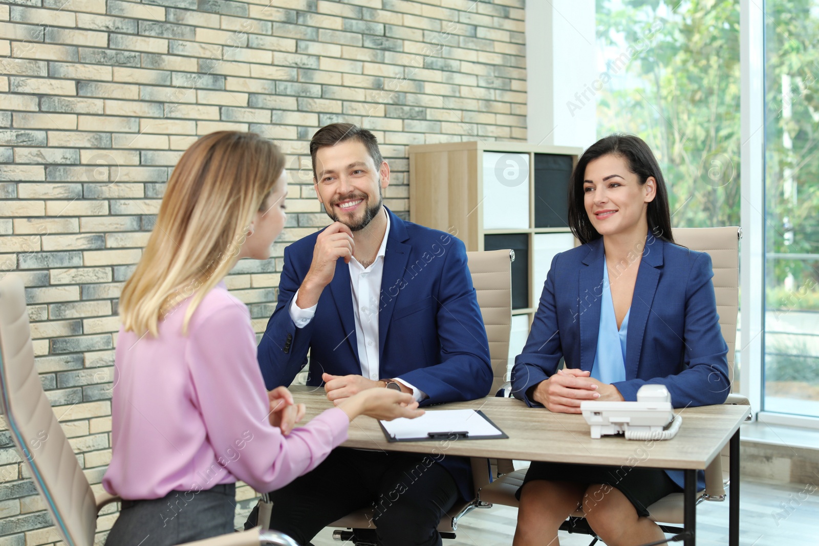 Photo of Human resources commission conducting job interview with applicant in office