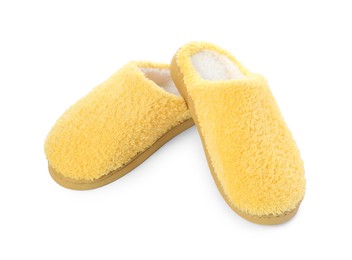 Pair of yellow soft slippers isolated on white