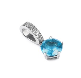 Photo of Elegant silver pendant with light blue gemstone isolated on white. Luxury jewelry