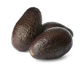 Photo of Whole fresh ripe avocadoes on white background