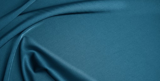 Image of Blue silk fabric as background, top view with space for text. Banner design