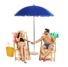 Photo of Young couple with beach accessories on sun loungers against white background