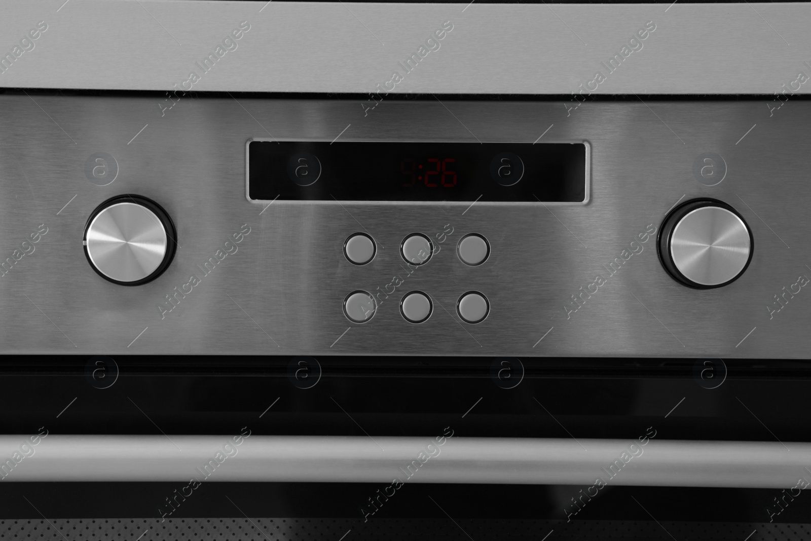 Photo of Oven setting panel with display and buttons, closeup