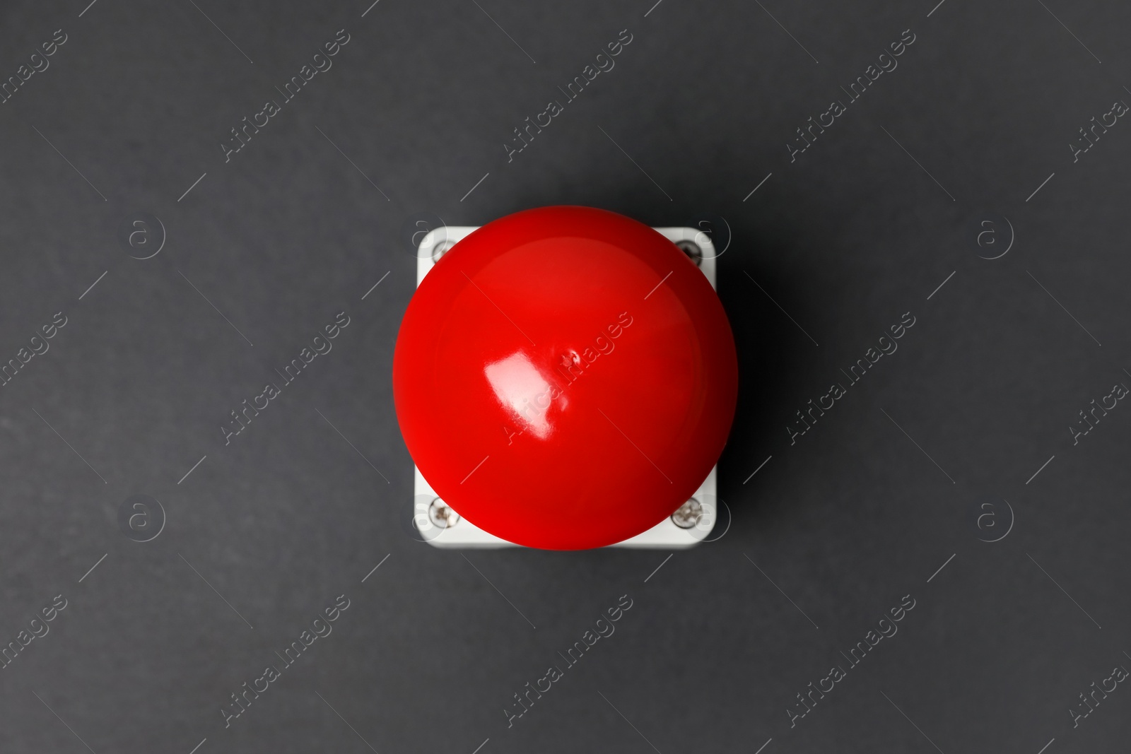 Photo of Red button of nuclear weapon on grey background, top view. War concept