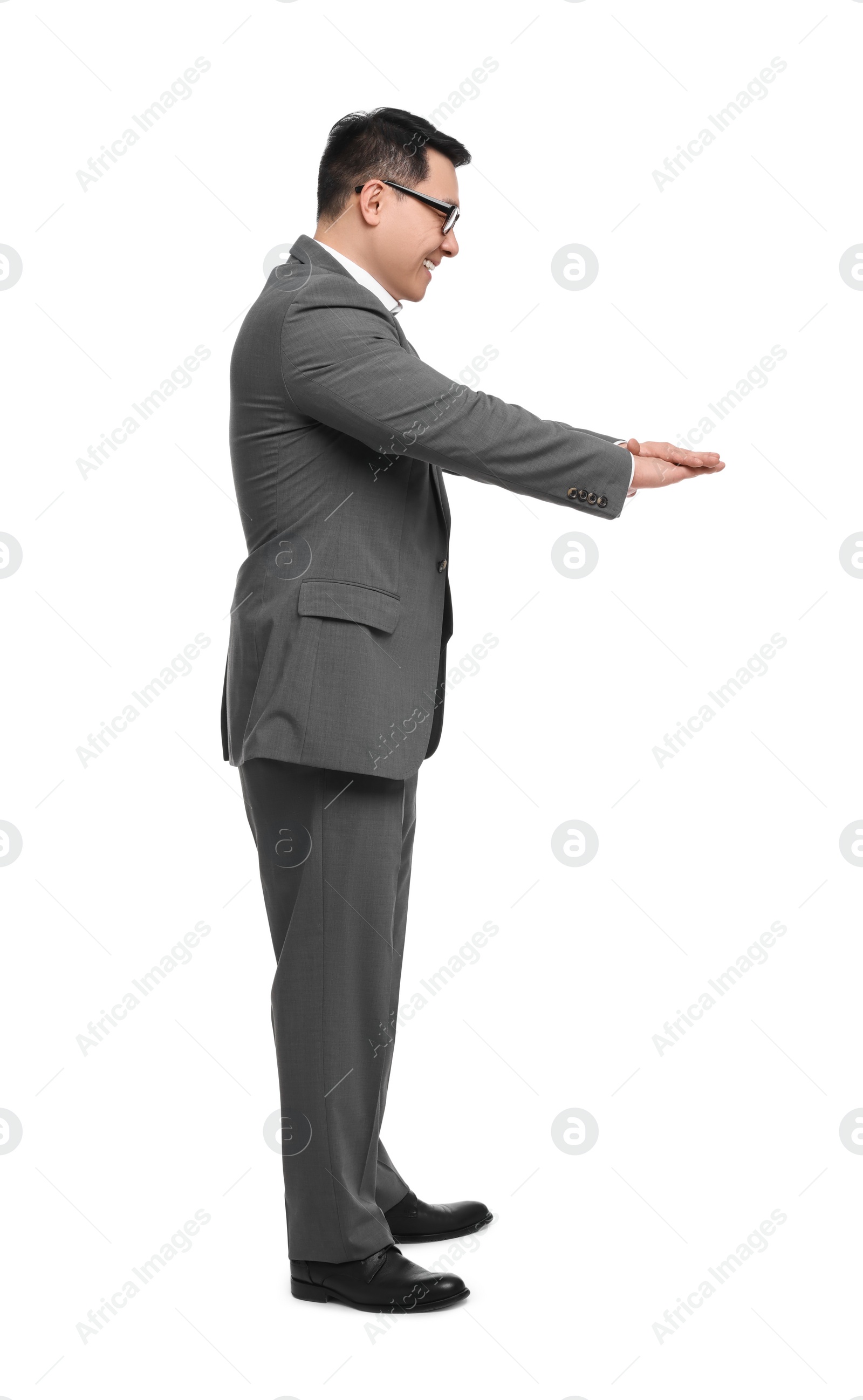 Photo of Businessman in suit posing on white background