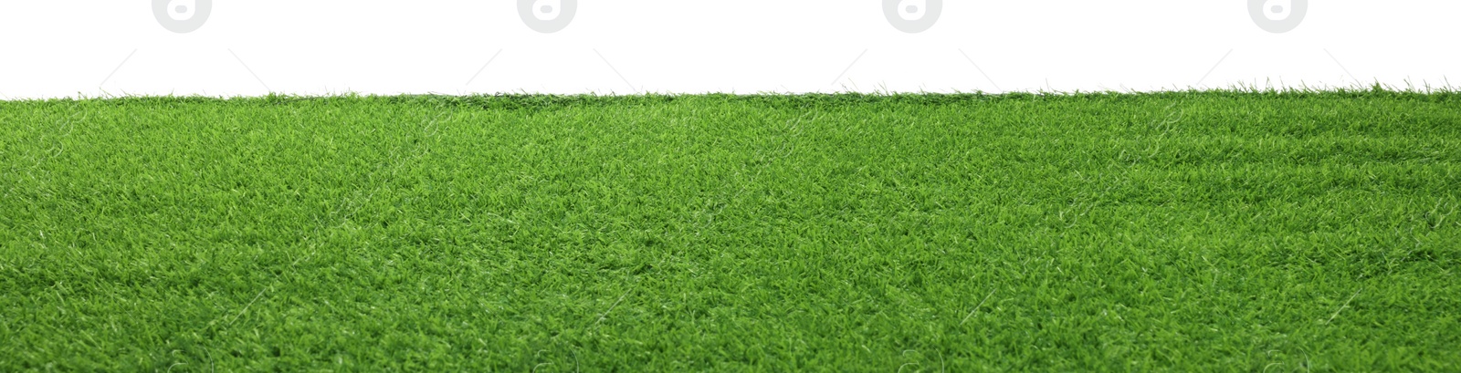 Photo of Green artificial grass surface isolated on white