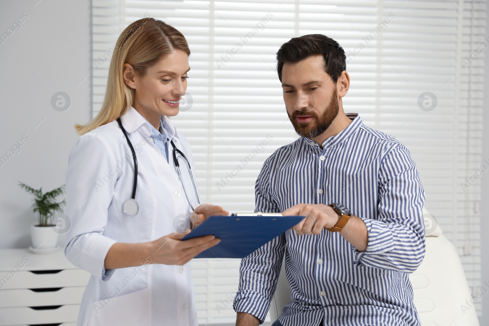 Photo of Patient having appointment with doctor in clinic