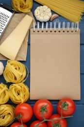 Blank recipe book and different ingredients on blue wooden table, flat lay. Space for text