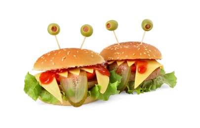 Photo of Cute monster burgers isolated on white. Halloween party food