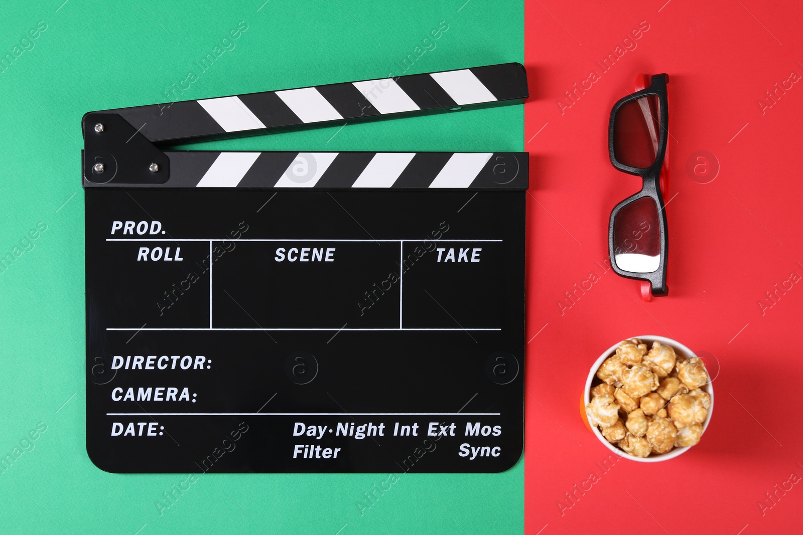 Photo of Clapperboard, popcorn and 3D glasses on color background