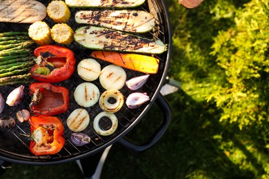 Photo of Delicious grilled vegetables on barbecue grill outdoors