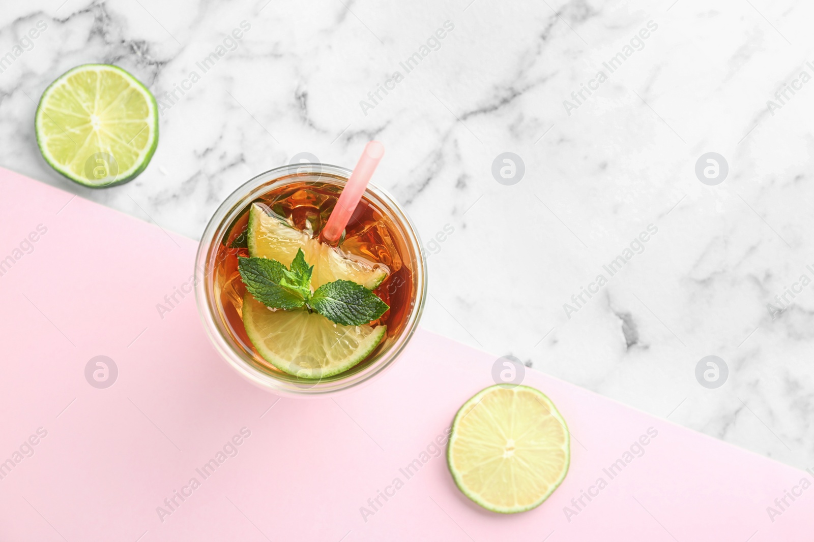 Photo of Flat lay composition with refreshing iced tea on table. Space for text