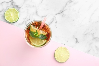 Photo of Flat lay composition with refreshing iced tea on table. Space for text