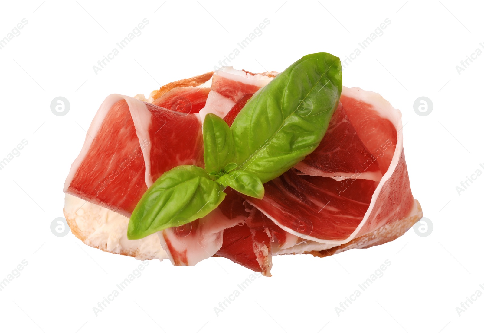 Photo of Tasty sandwich with cured ham and basil leaves isolated on white, top view