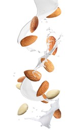 Image of Delicious almond milk and nuts on white background