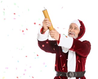 Photo of Man in Santa Claus costume blowing up party popper on white background
