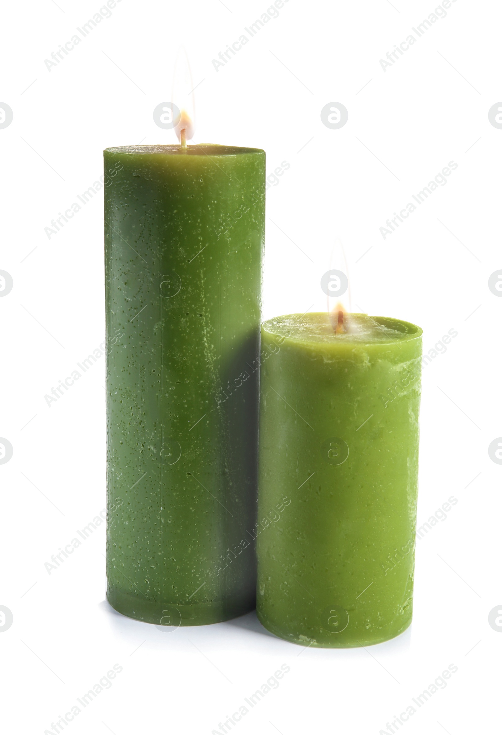 Photo of Two decorative green wax candles on white background