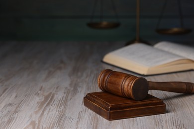 Photo of Law concept. Judge's gavel on light wooden table, space for text